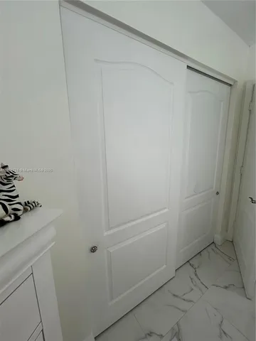 a bathroom with a shower and vanity