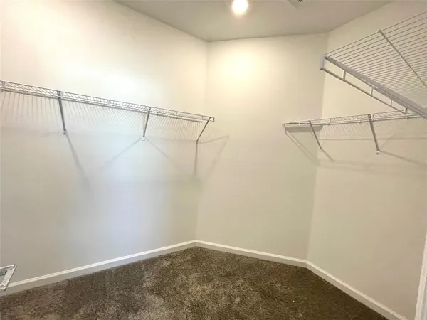a view of a room with racks on the wall