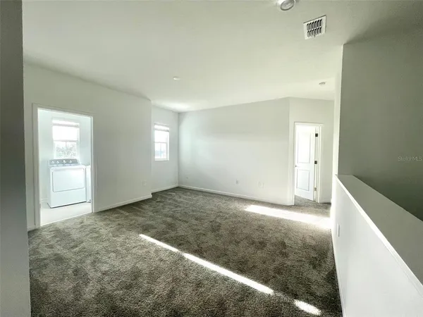 a view of an empty room and window