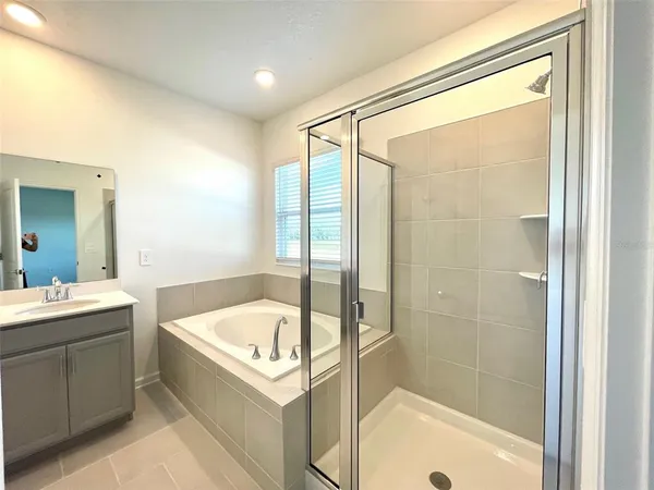 a bathroom with a bathtub and a sink
