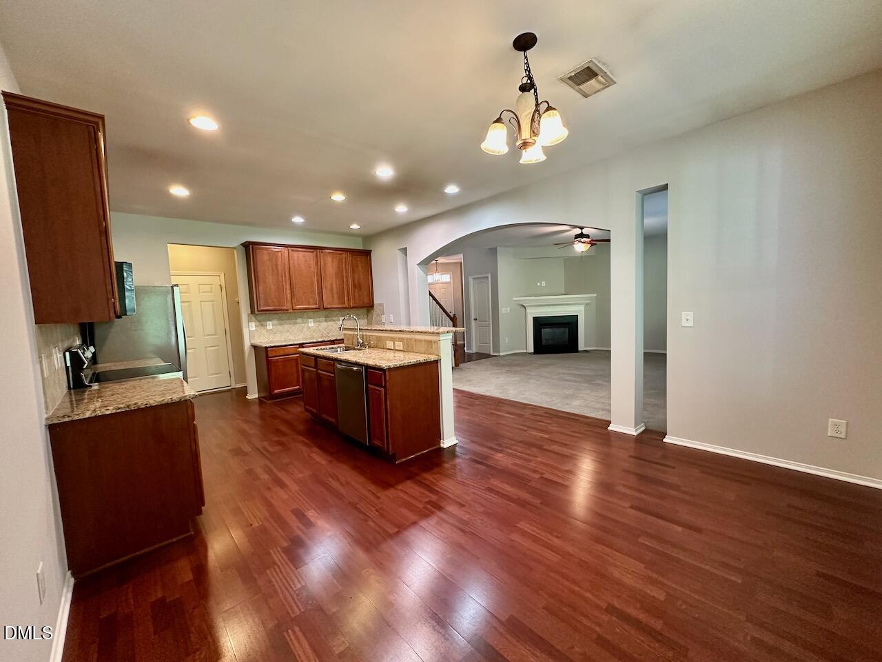 8208 Stone Cellar Drive Raleigh, NC 27613 - Photo 15 of 34 a view of a kitchen with sink microwave and stove