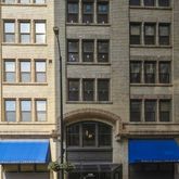 a front view of a building with a lot of windows