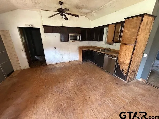 a view of a kitchen with a sink and cabinet