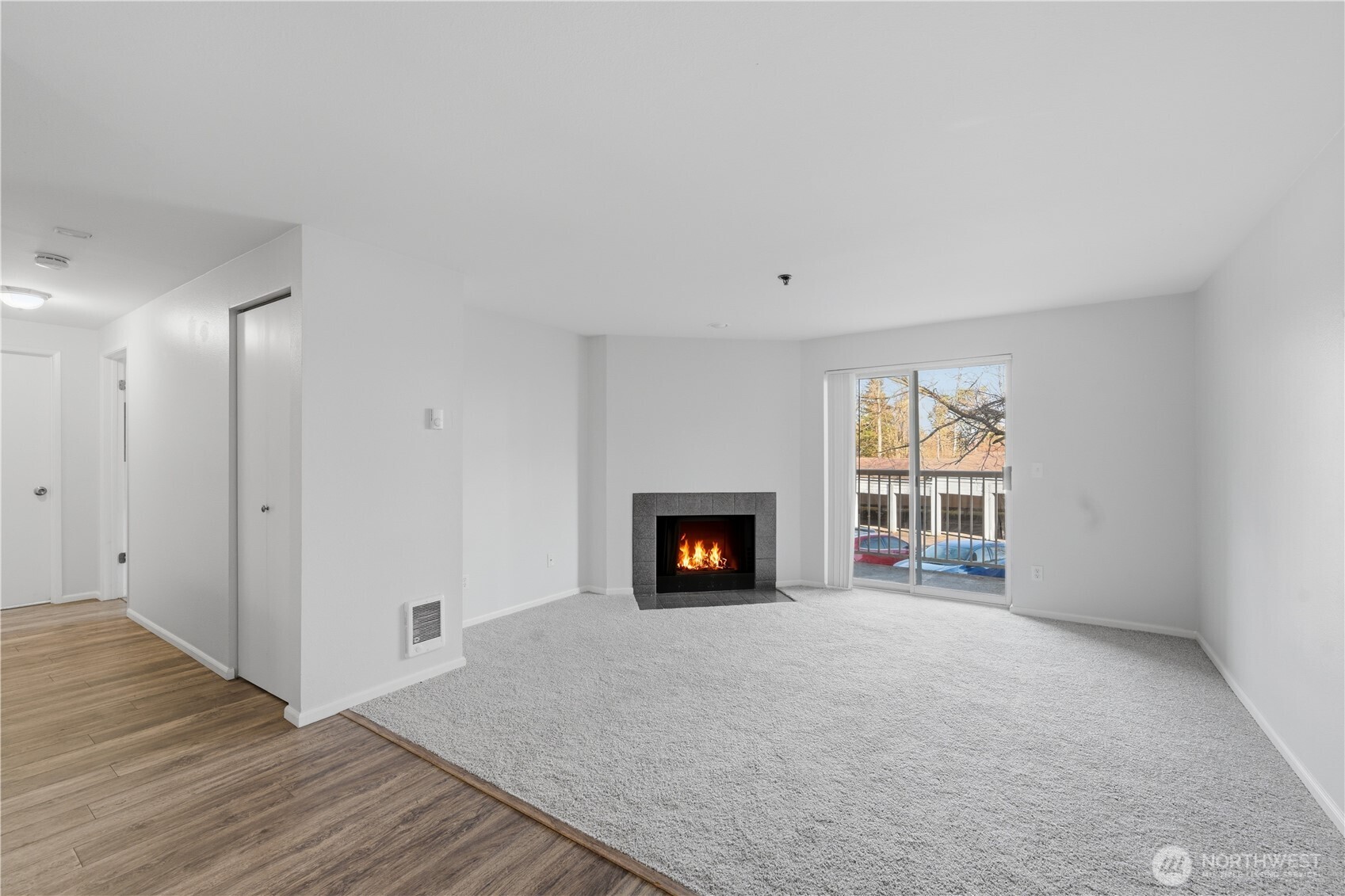 975 Aberdeen Avenue Northeast, Unit F308 Renton, WA 98056 - Photo 7 of 20 a view of a livingroom with wooden floor and a fireplace