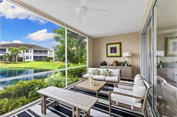 a living room with furniture and a yard