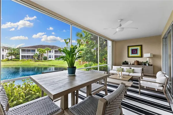 a view of a livingroom with furniture window and wooden floor