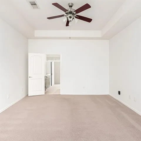an empty room with fan