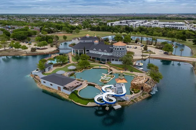 an aerial view of a house with outdoor space