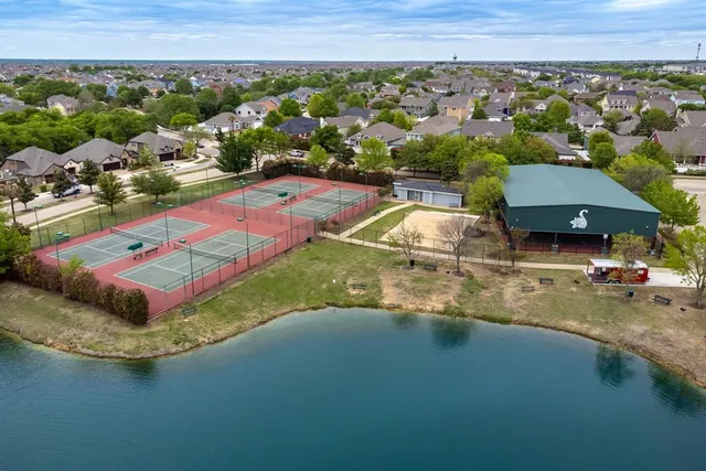 an aerial view of a house with a swimming pool