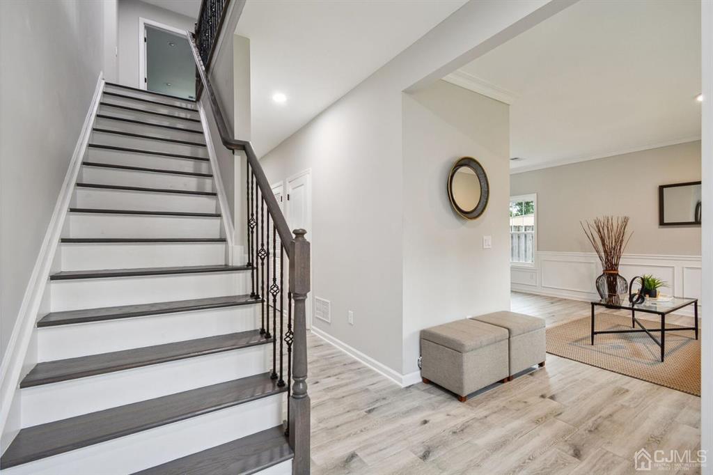 109 Idlewild Road Edison, NJ 08817 - Photo 10 of 15 a living room with furniture and wooden floor