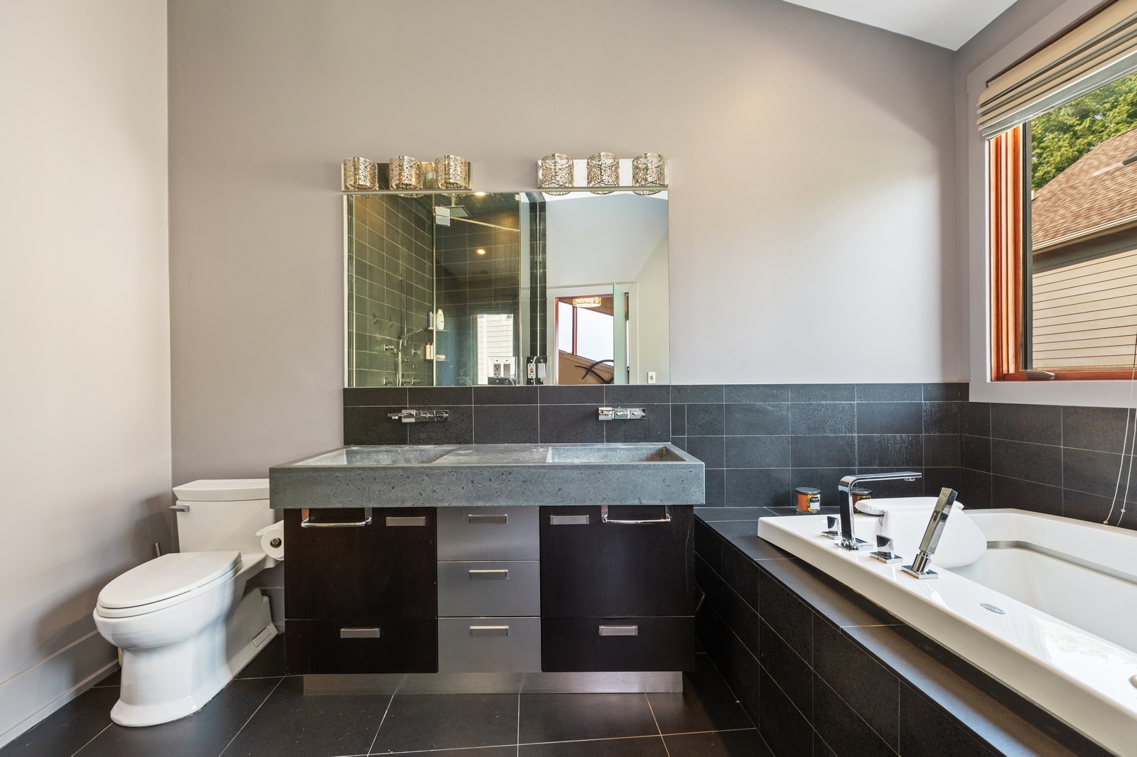 1565 Harding Road Northfield, IL 60093 - Photo 13 of 35 a bathroom with a granite countertop sink a toilet and mirror