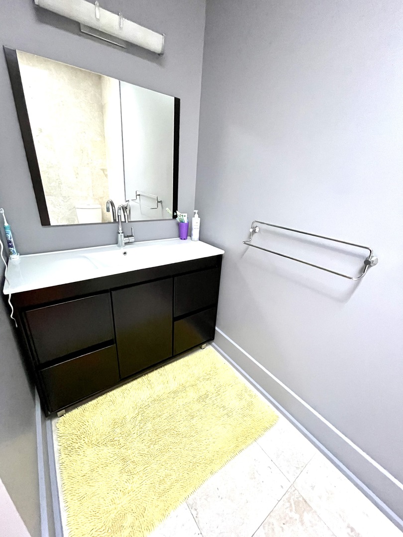 1565 Harding Road Northfield, IL 60093 - Photo 18 of 35 a bathroom with a sink and a mirror