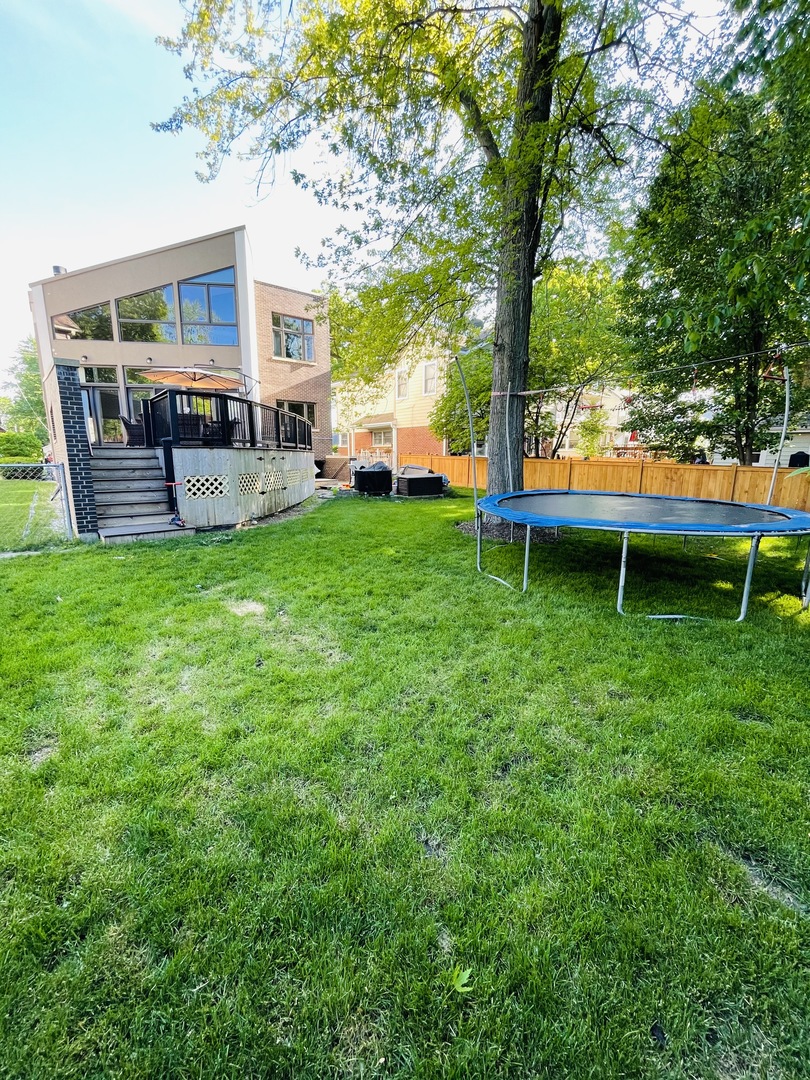 1565 Harding Road Northfield, IL 60093 - Photo 28 of 35 a view of a house with backyard and sitting area