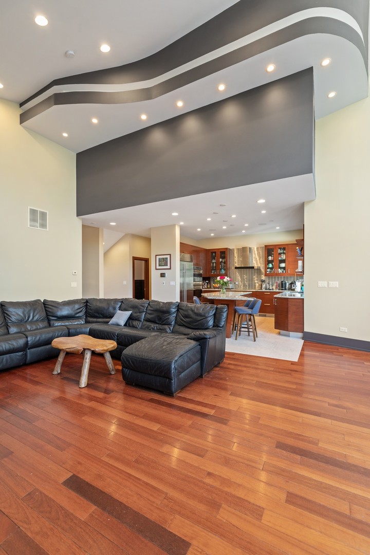 1565 Harding Road Northfield, IL 60093 - Photo 10 of 35 a living room with lots of furniture and a wooden floor
