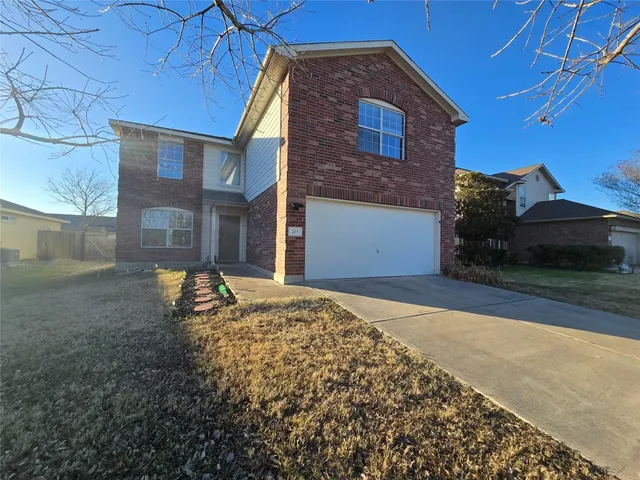 a house view with a backyard space