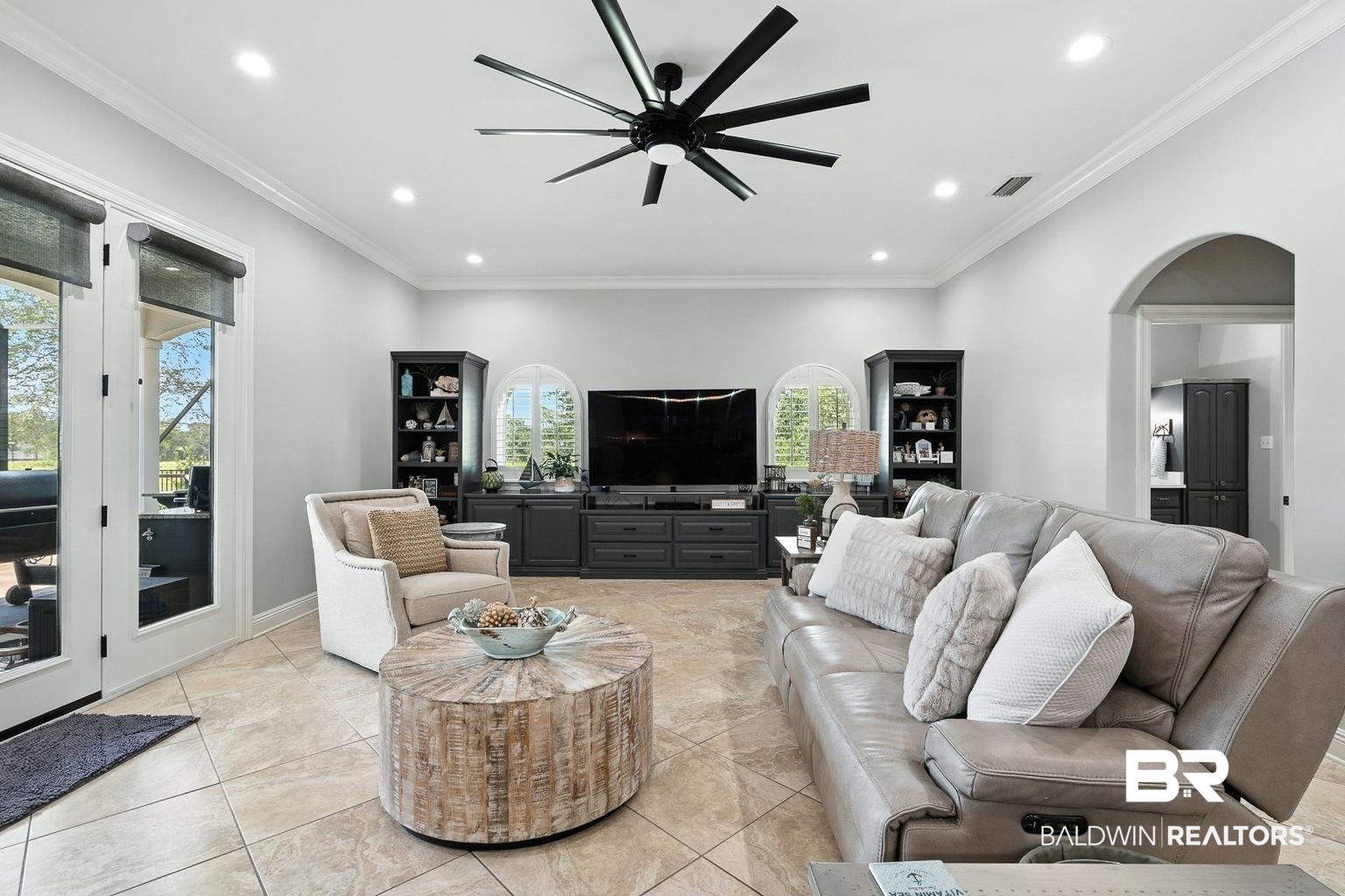 23357 Carnoustie Drive Foley, AL 36535 - Photo 18 of 99 Living area featuring ceiling fan, crown molding, recessed lighting, arched walkways, and light tile patterned floors