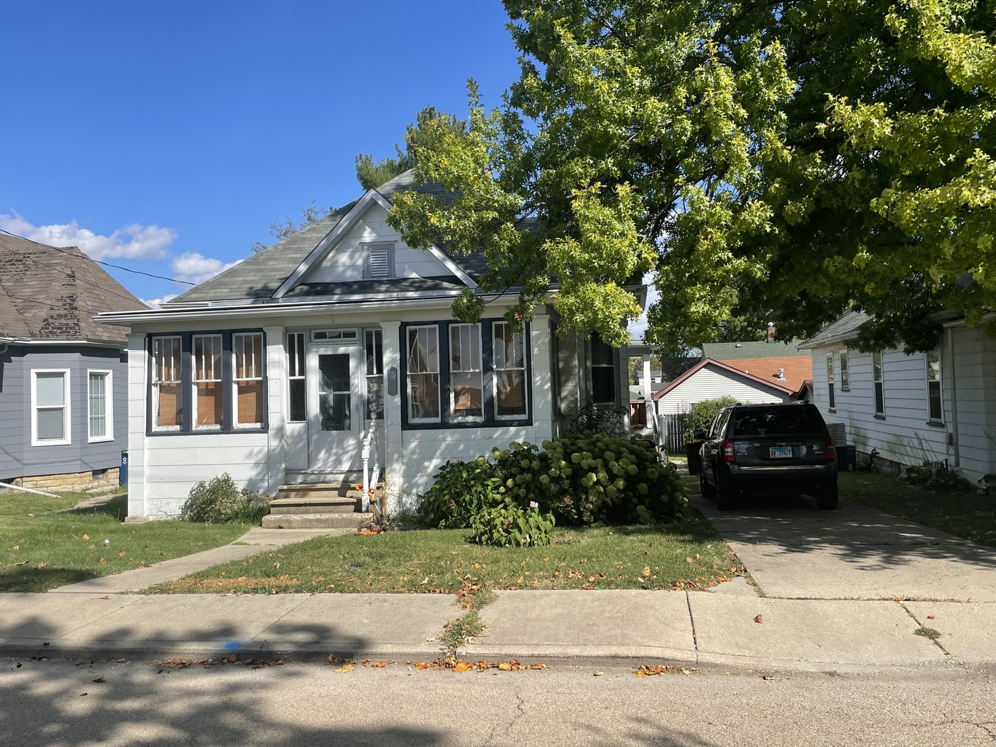 1407 Pulaski Street Peru, IL 61354 - Photo 2 of 9 a front view of a house with a garden and plants