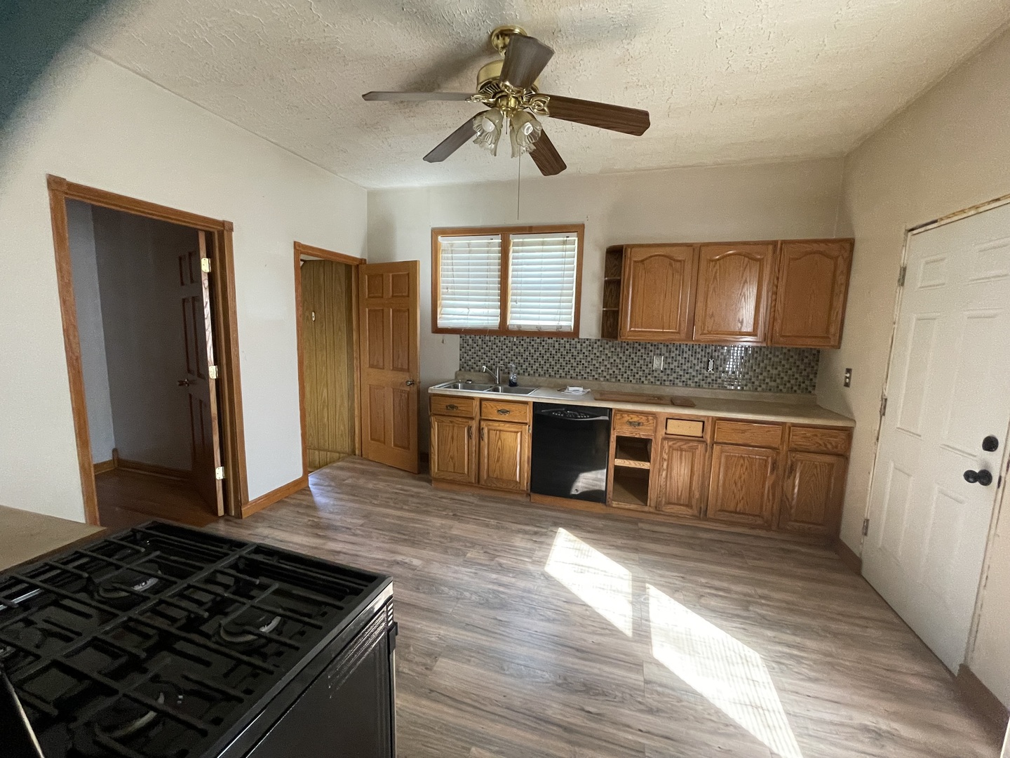 1407 Pulaski Street Peru, IL 61354 - Photo 3 of 9 a kitchen with stainless steel appliances granite countertop a stove a sink and a refrigerator