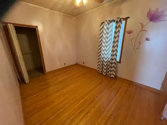 a view of walk in closet with clothes