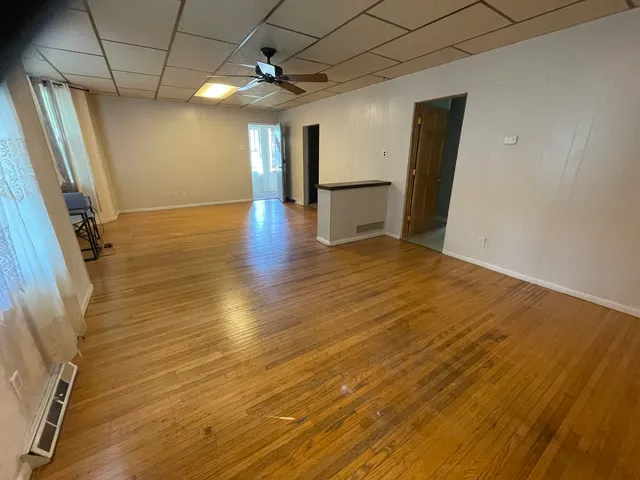 a view of a livingroom with wooden floor