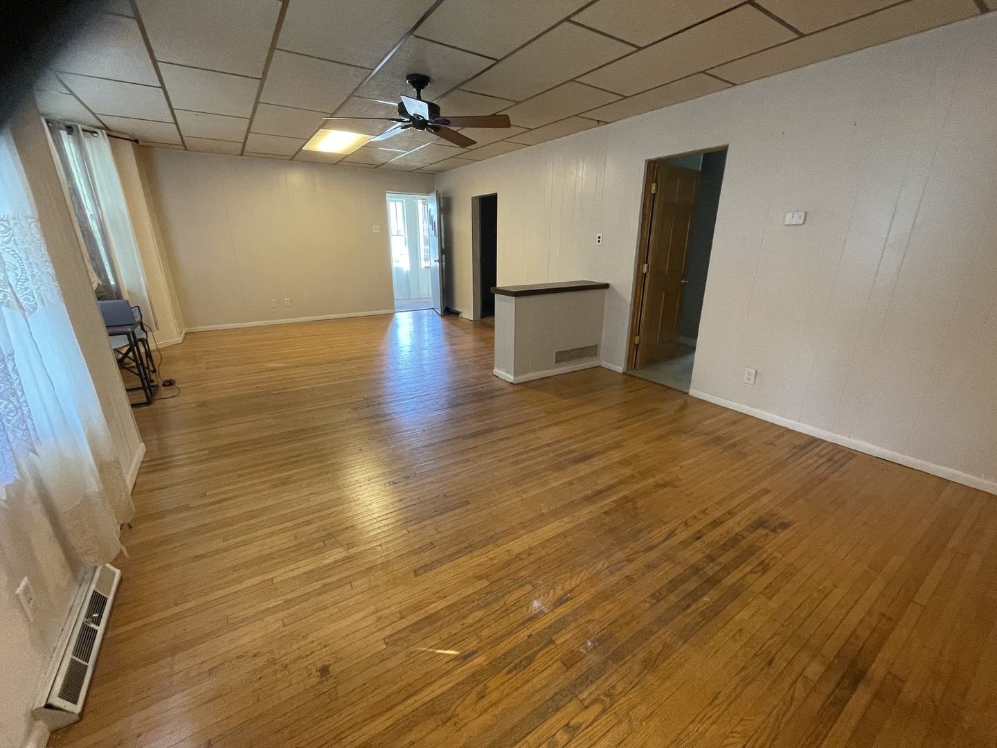 1407 Pulaski Street Peru, IL 61354 - Photo 5 of 9 a view of a livingroom with wooden floor