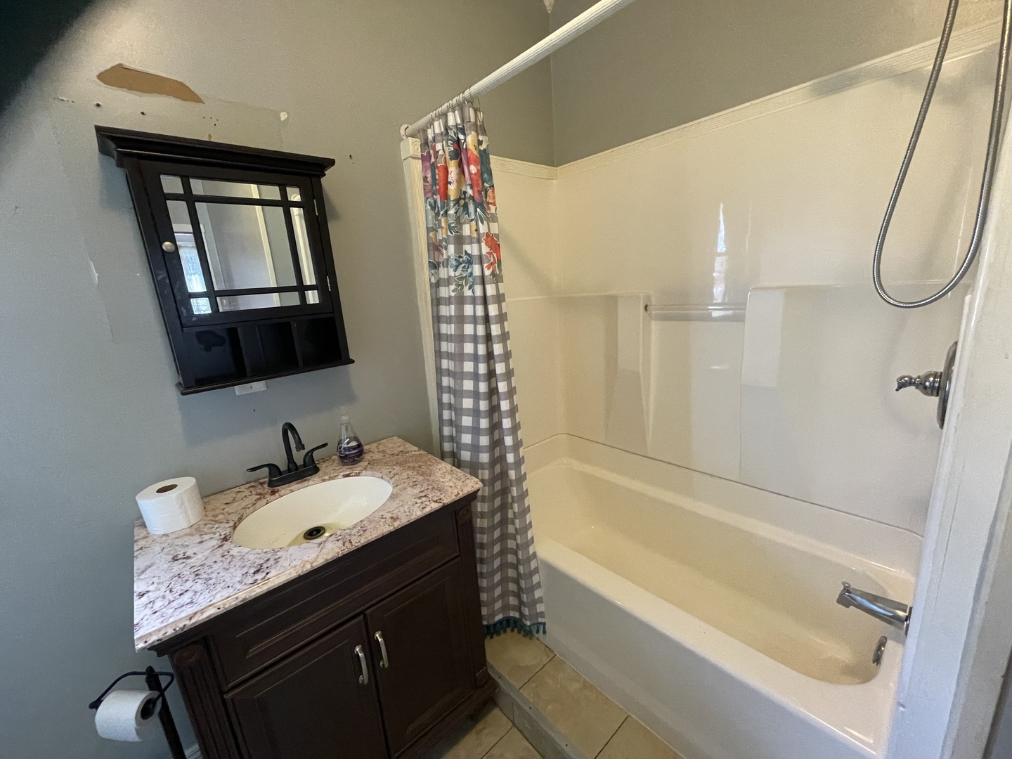 1407 Pulaski Street Peru, IL 61354 - Photo 7 of 9 a bathroom with a tub sink and mirror