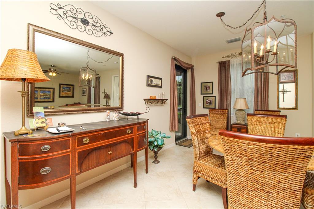 9054 Capistrano Street North, Unit 4003 Naples, FL 34113 - Photo 11 of 49 a spacious bathroom with a sink double vanity and a mirror