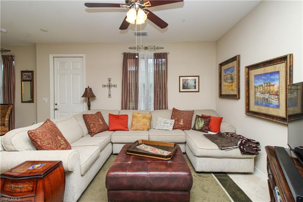 9054 Capistrano Street North, Unit 4003 Naples, FL 34113 - Photo 19 of 49 a living room with furniture and a couch