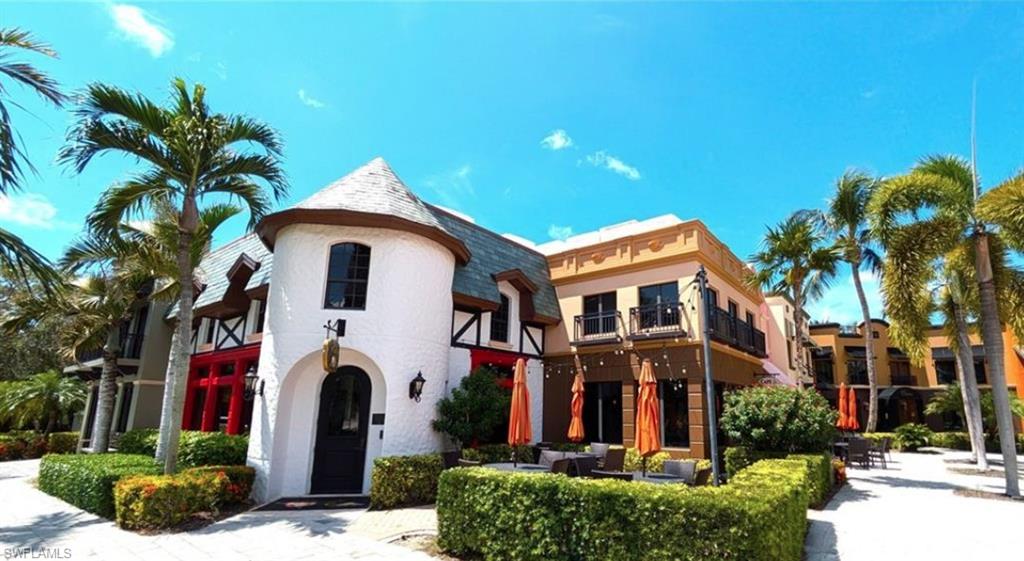 9054 Capistrano Street North, Unit 4003 Naples, FL 34113 - Photo 36 of 49 a front view of a house with a yard