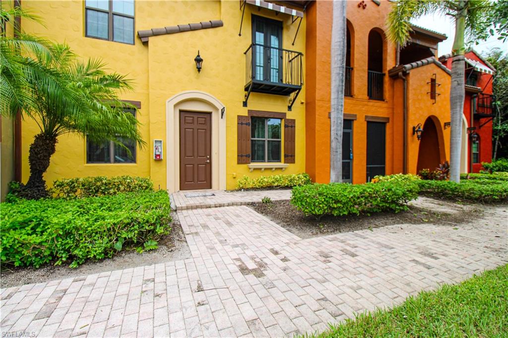 9054 Capistrano Street North, Unit 4003 Naples, FL 34113 - Photo 4 of 49 front view of a brick building
