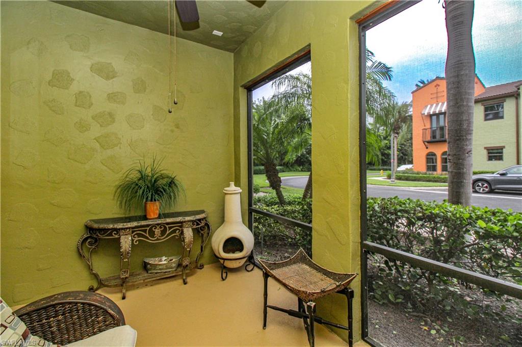 9054 Capistrano Street North, Unit 4003 Naples, FL 34113 - Photo 5 of 49 a view of a bathroom with a sink and glass door