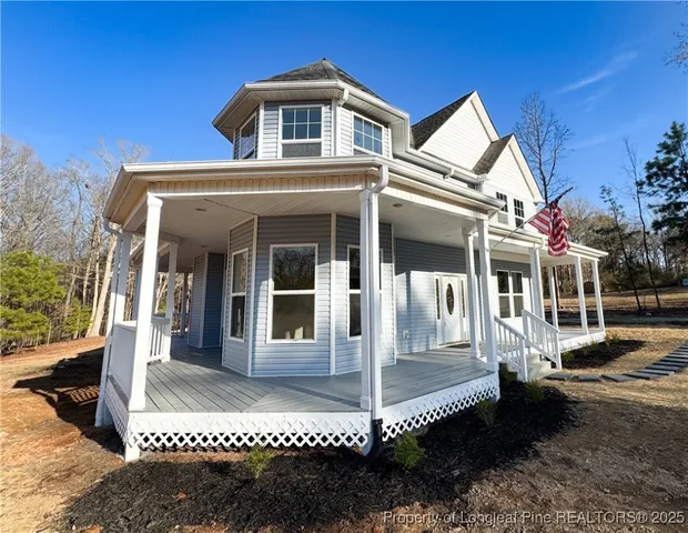 a front view of a house with a porch