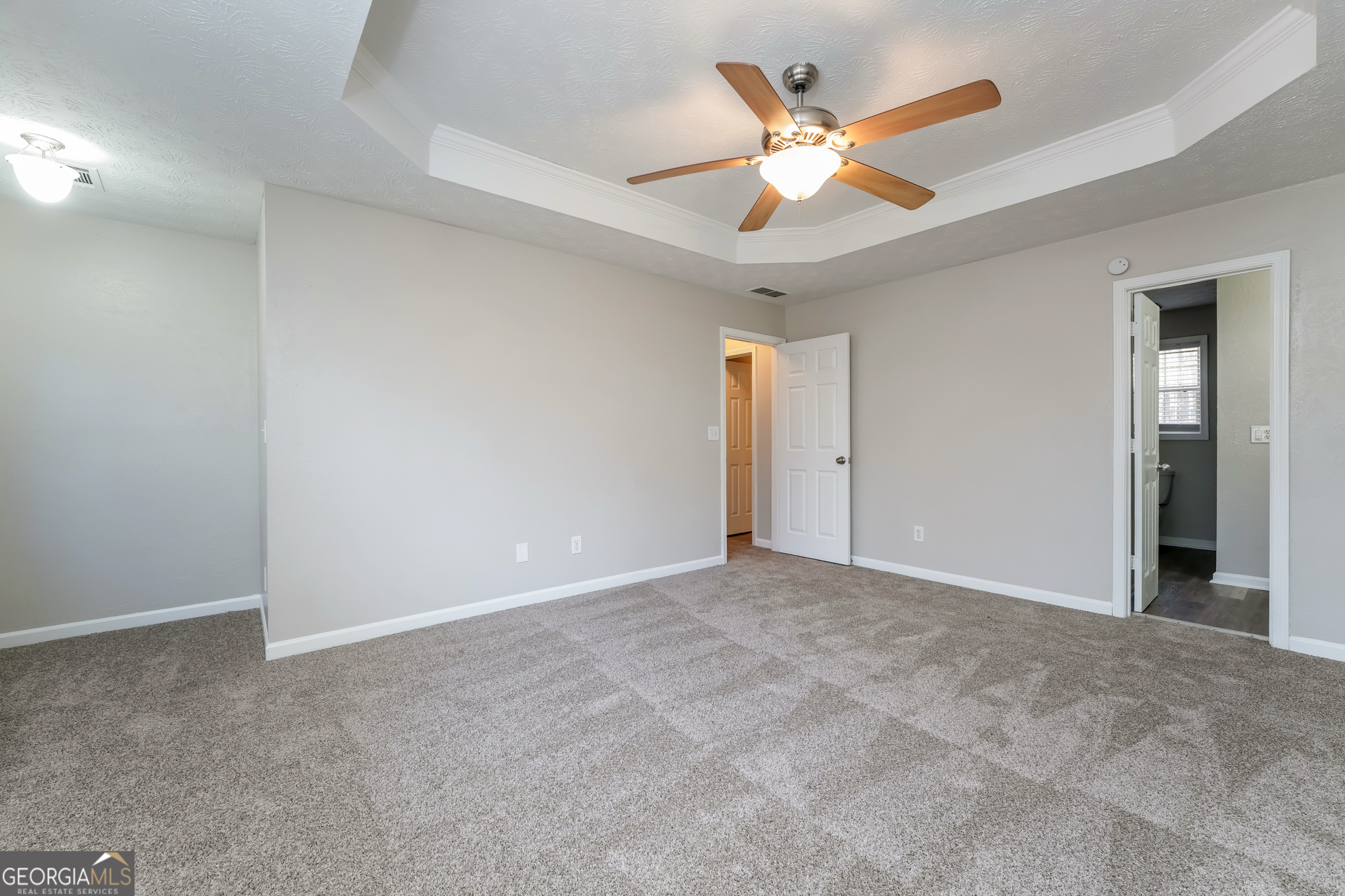 310 Alcovy Way Covington, GA 30014 - Photo 11 of 22 an empty room with closet and ceiling fan