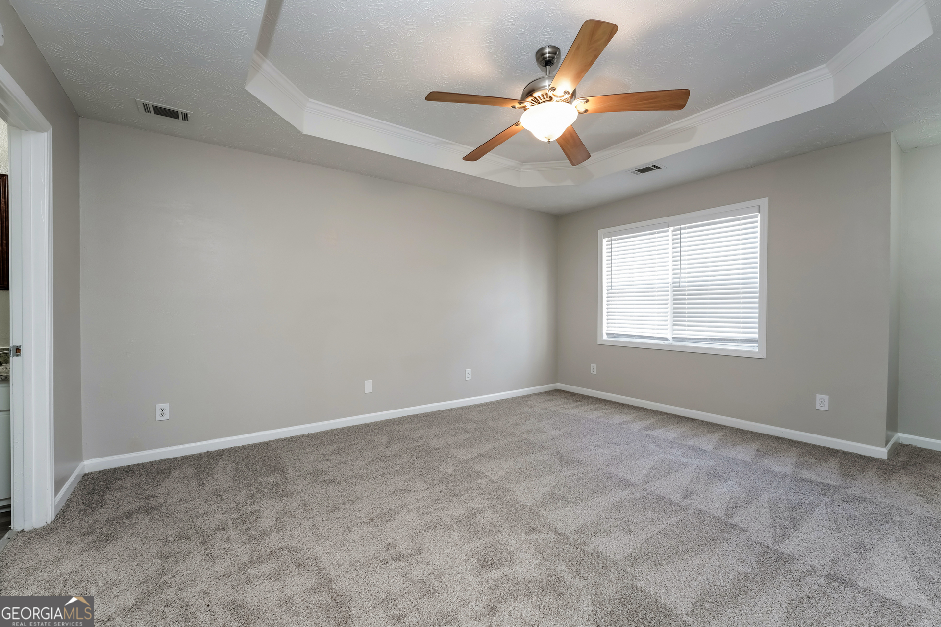 310 Alcovy Way Covington, GA 30014 - Photo 12 of 22 a view of an empty room with a window