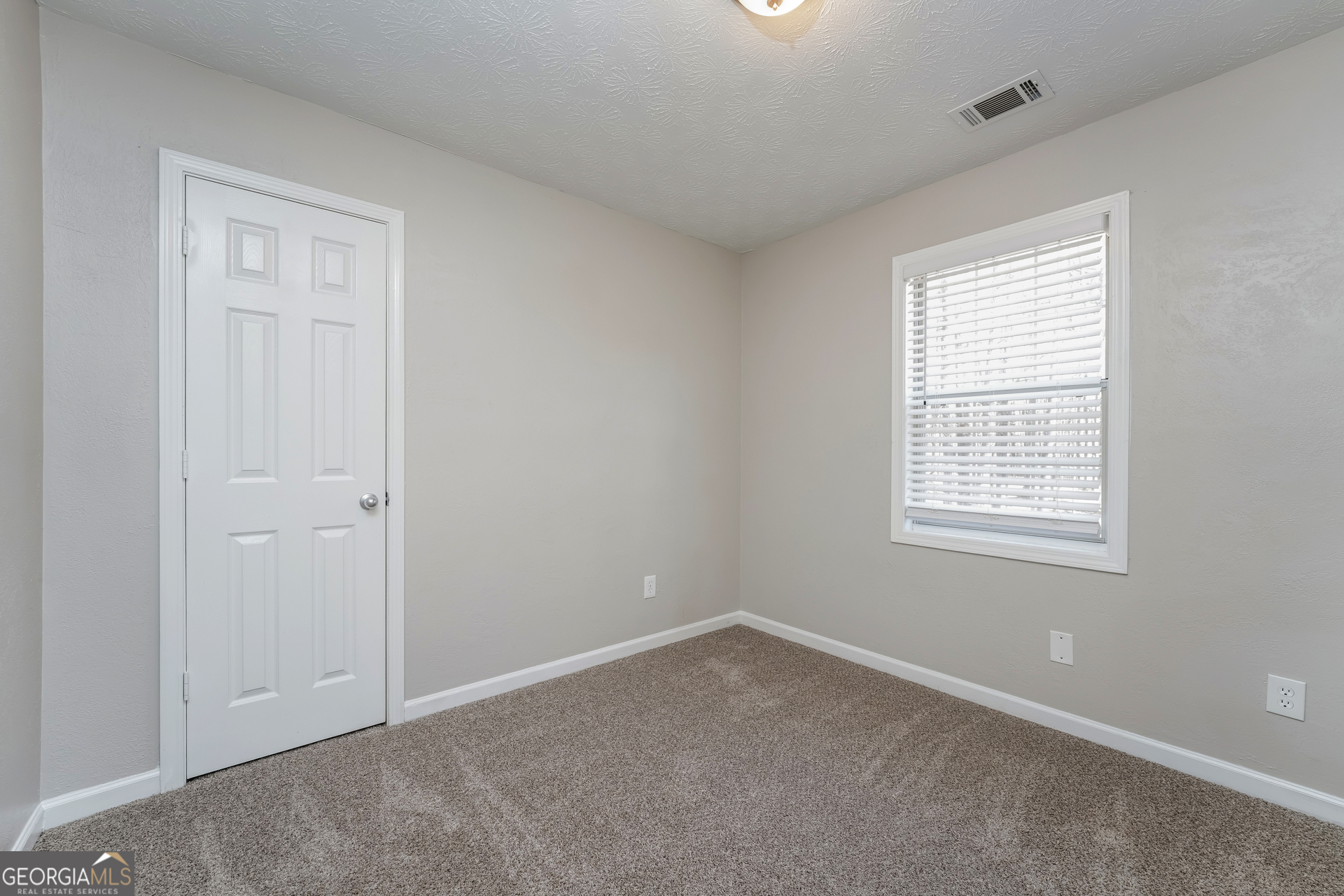 310 Alcovy Way Covington, GA 30014 - Photo 15 of 22 a view of an empty room with a window