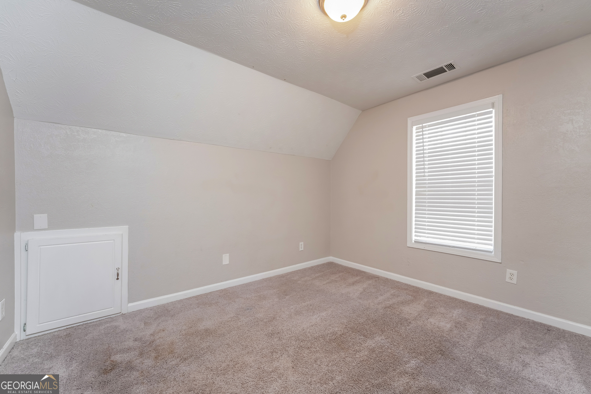 310 Alcovy Way Covington, GA 30014 - Photo 16 of 22 a view of an empty room with a window