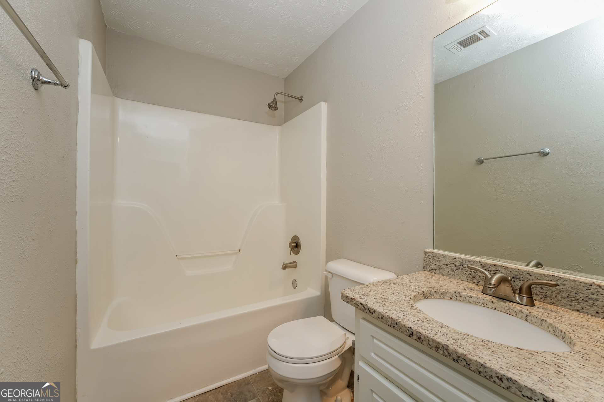 310 Alcovy Way Covington, GA 30014 - Photo 19 of 22 a bathroom with a granite countertop sink toilet and shower