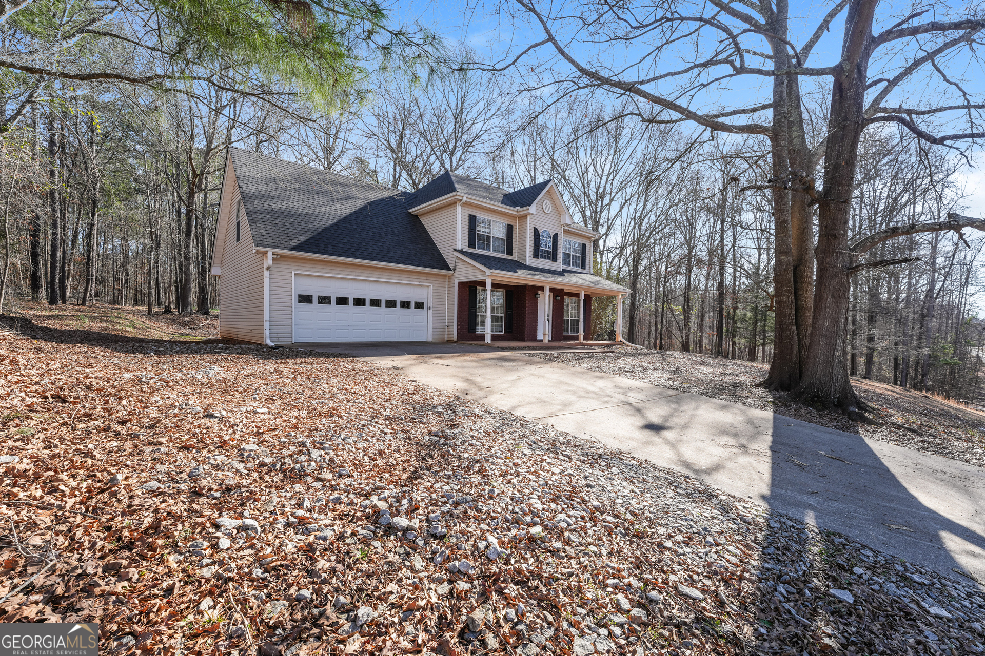 310 Alcovy Way Covington, GA 30014 - Photo 4 of 22 a front view of a house with a yard and large trees