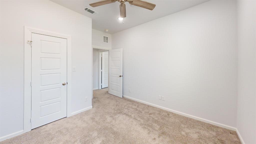 336 Buck Ridge Drive Frisco, TX 75068 - Photo 14 of 23 Carpeted interior room with light-colored walls and white trim