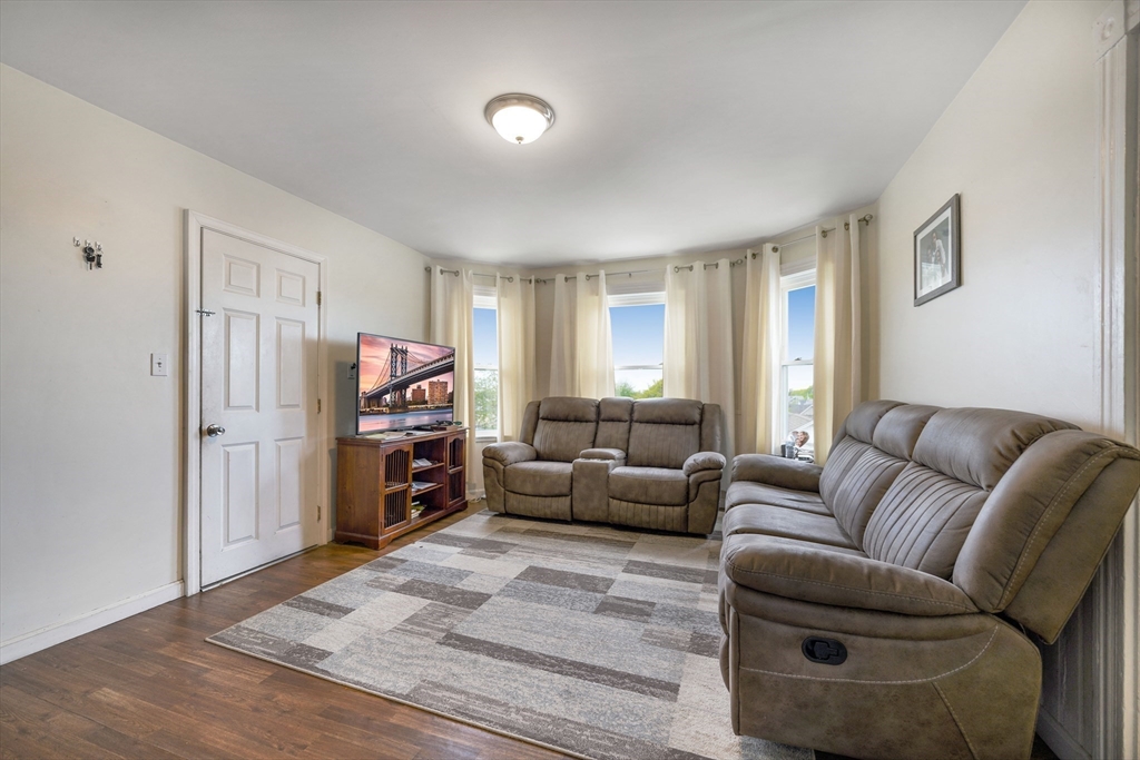 80 Lane Street, Unit 3 Fall River, MA 02721 - Photo 2 of 11 a living room with furniture and a flat screen tv