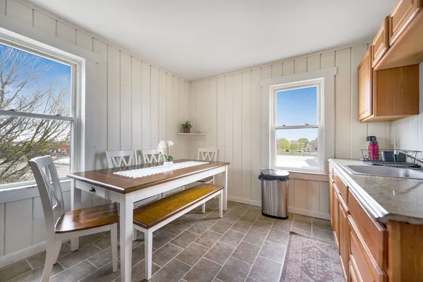 a kitchen with a stove sink and cabinets