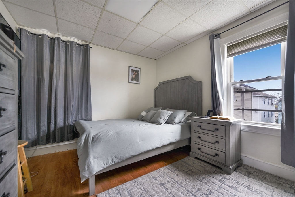 80 Lane Street, Unit 3 Fall River, MA 02721 - Photo 6 of 11 a bedroom with a bed window and dresser
