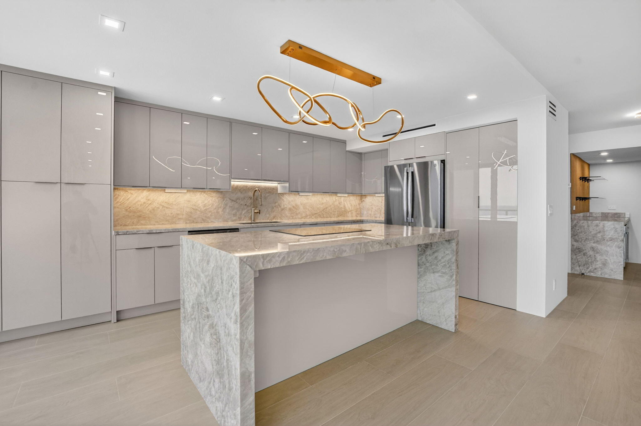 2800 South Ocean Boulevard, Unit 23C Boca Raton, FL 33432 - Photo 18 of 50 a kitchen with stainless steel appliances granite countertop a refrigerator and a stove