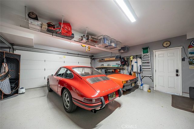 a kitchen with stainless steel appliances kitchen island granite countertop a sink and cabinets