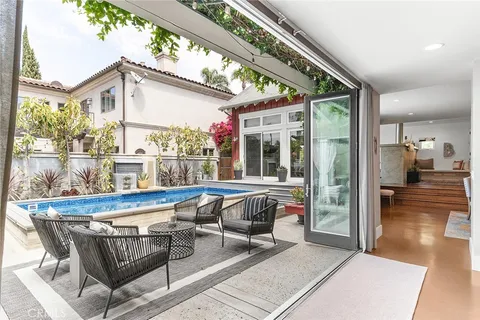 a kitchen with stainless steel appliances kitchen island granite countertop a sink and cabinets