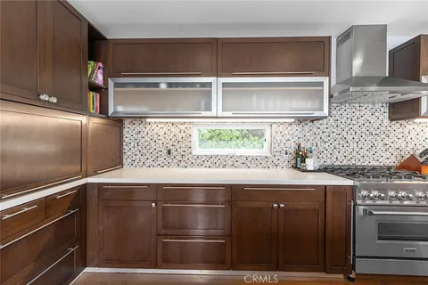 a spacious bedroom with a bed and glass windows