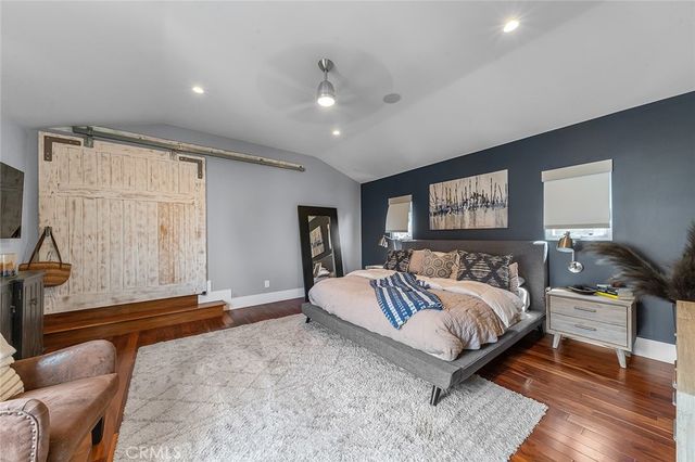 a view of a kitchen with stainless steel appliances granite countertop a sink and cabinets