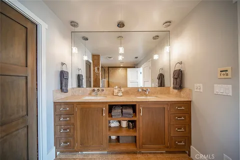 a bed room with a bed and a painting on the wall