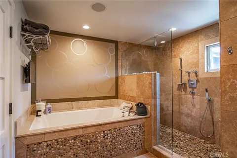 a bedroom with a bed and a television