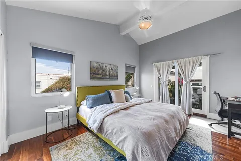 a bedroom with bed and a window